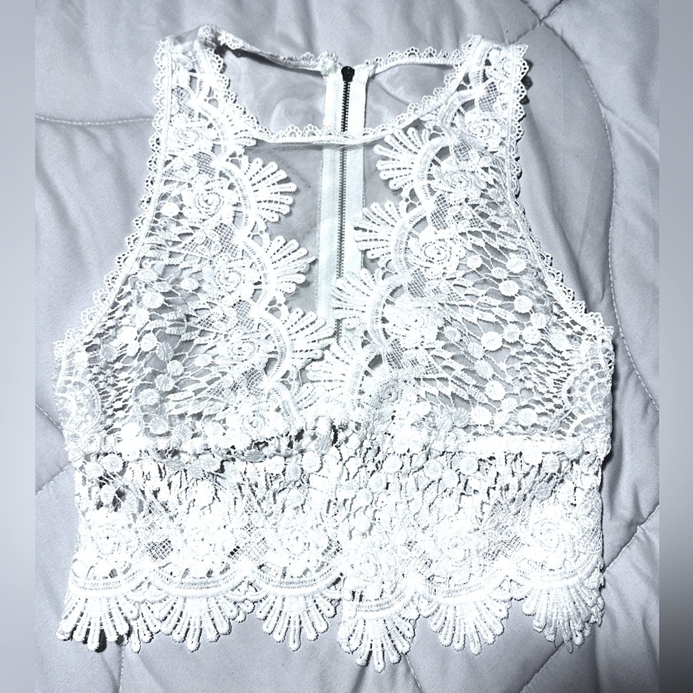 Cropped fully laced top, zips in back.
